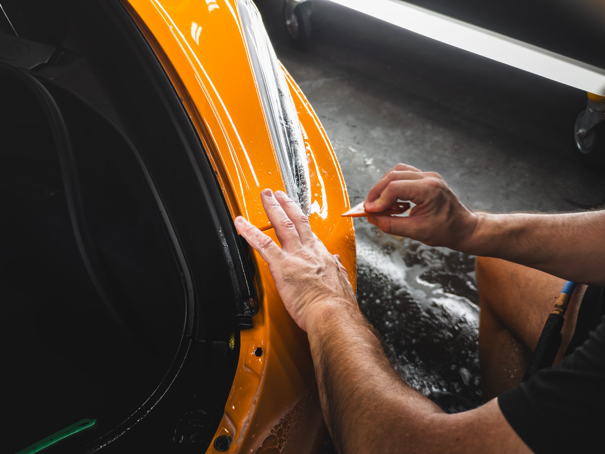 Applying paint protection film to a McLaren GT